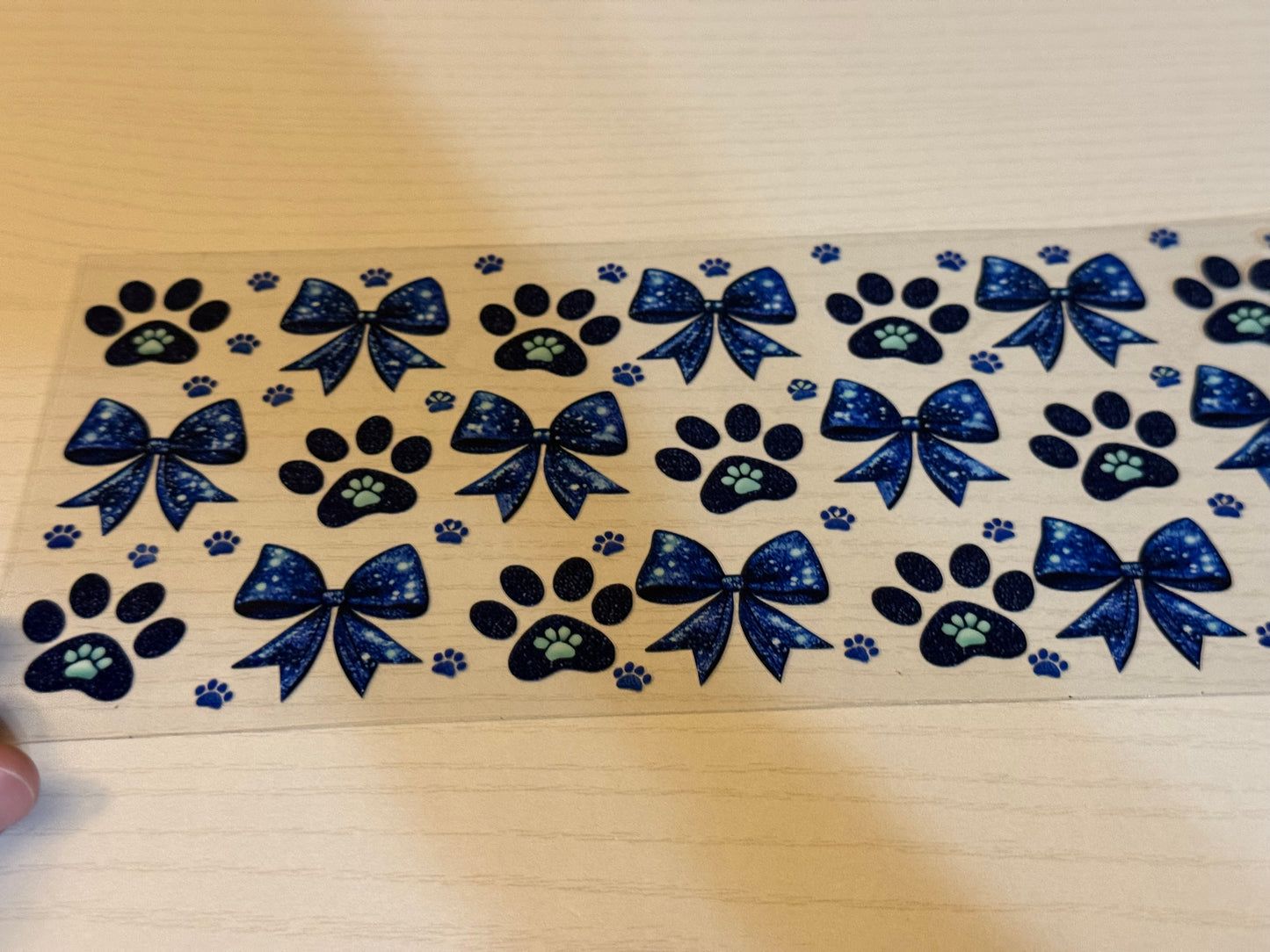 Blue dog paws and bows.